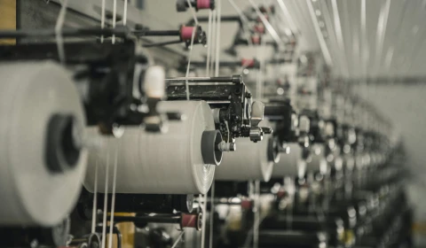 Factory machines spinning garment fabrics