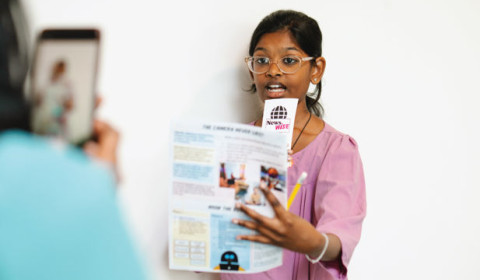 Image of a child presenting the news