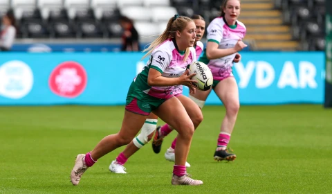 An image of women playing rugby.