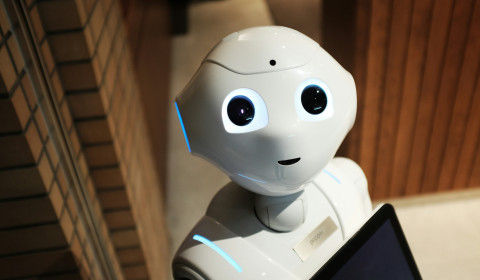 A robot with a tablet computer.