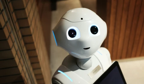 A robot with a tablet computer.